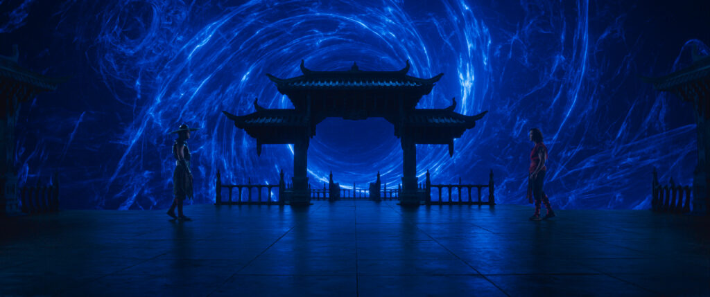 two men standing on a combat floor, illuminated in blue by a swirl CGI vortex